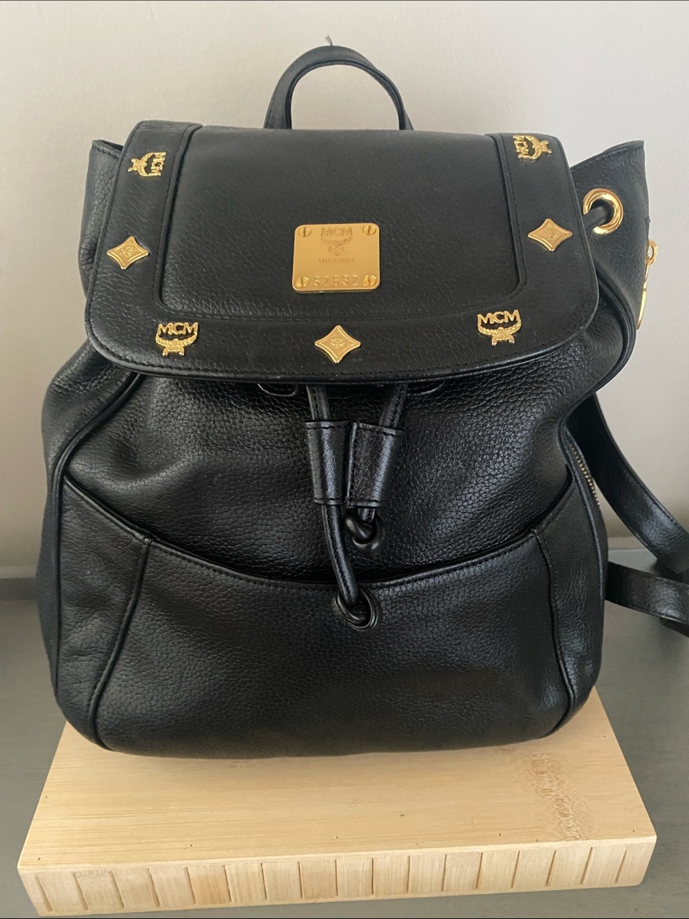 MCM Black Pebbled Leather Backpack with Gold Emblem Hardwarer